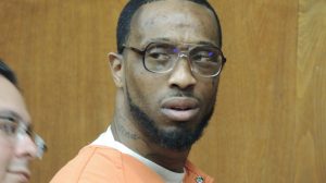 Jamaine Cole of Englewood flinches when he hears a plea offer for 15 years